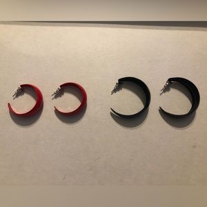 Two pairs of hoop earrings.